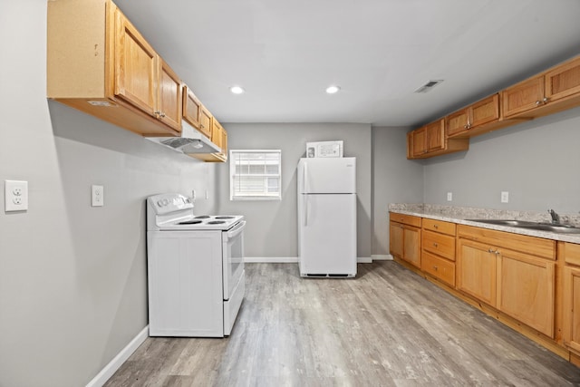 kitchen with sink, white appliances, and light hardwood / wood-style flooring