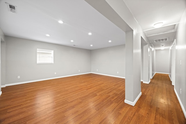 spare room featuring wood-type flooring