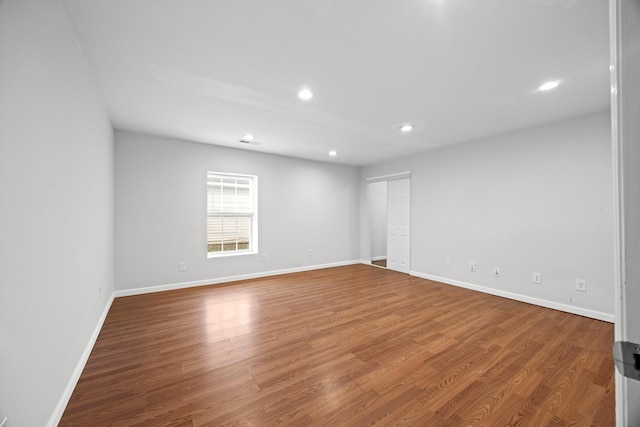 spare room featuring hardwood / wood-style flooring