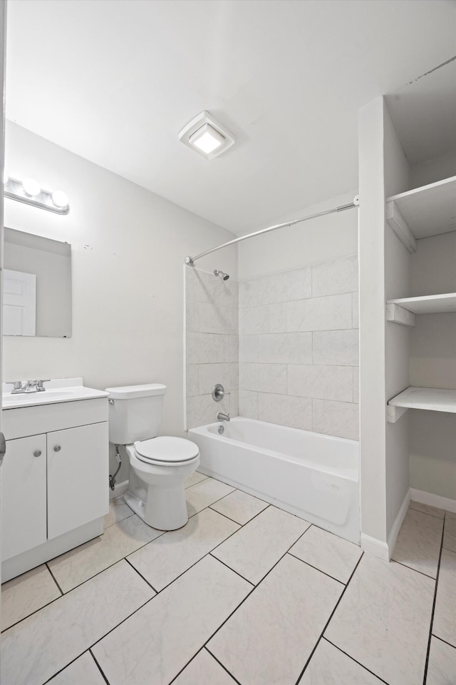 full bathroom featuring tile patterned floors, toilet, tiled shower / bath combo, and vanity