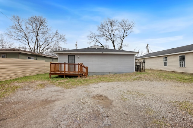 back of property featuring a deck