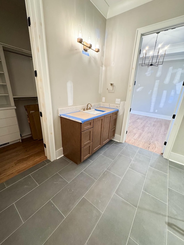 bathroom featuring vanity and wood-type flooring