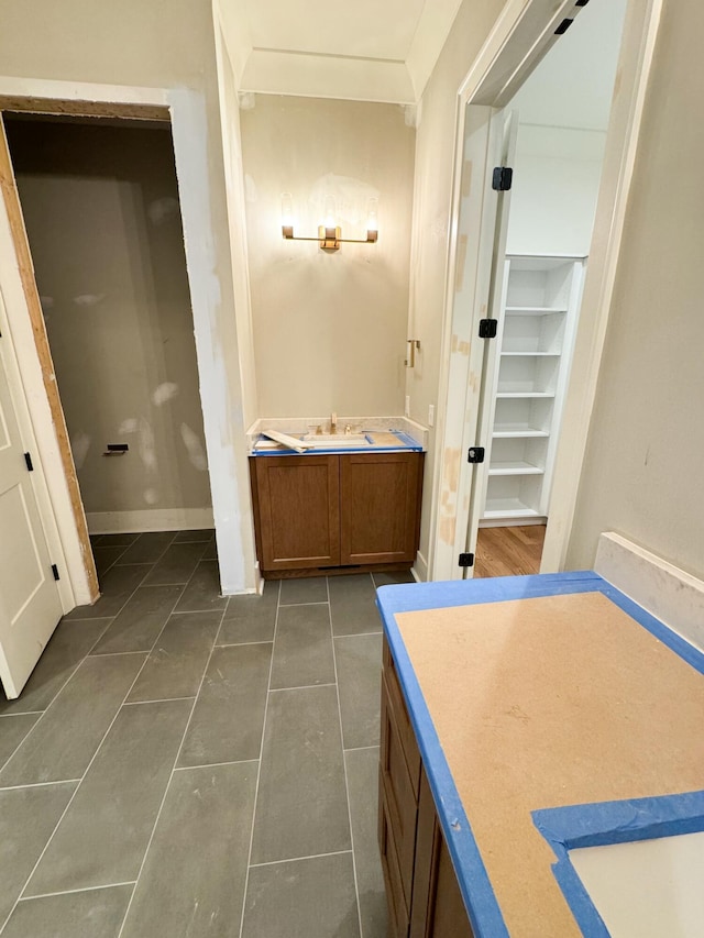 bathroom featuring tile patterned flooring and vanity