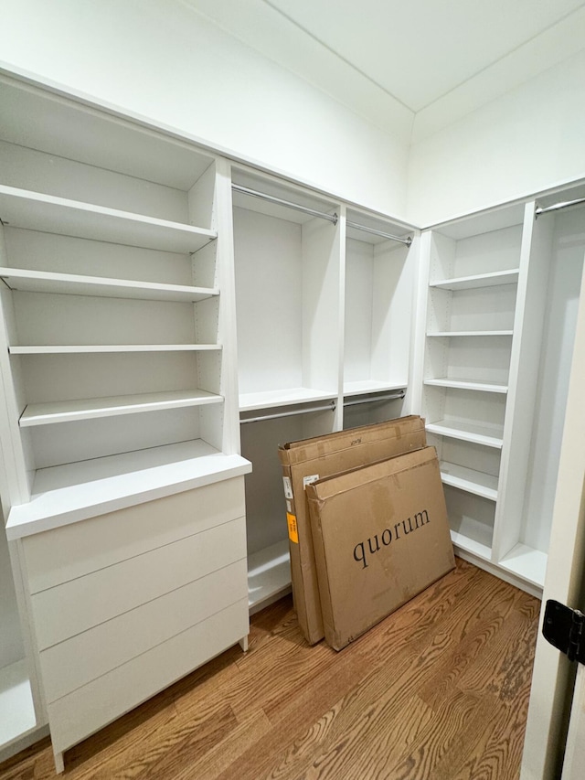 spacious closet featuring hardwood / wood-style floors