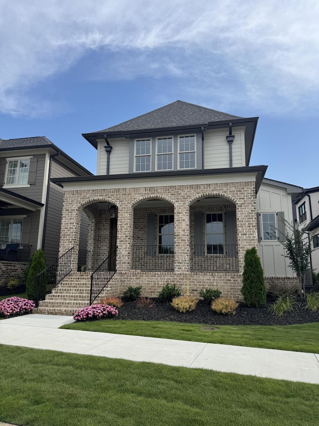 9418 Haviland Way, Ooltewah, TN 37363 - view of front of property featuring covered porch, brick siding, and a front yard
