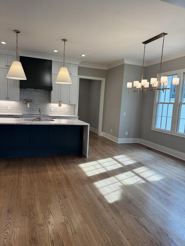 9418 Haviland Way, Ooltewah, TN 37363 - kitchen featuring range hood, light countertops, a chandelier, decorative backsplash, and dark wood-style flooring