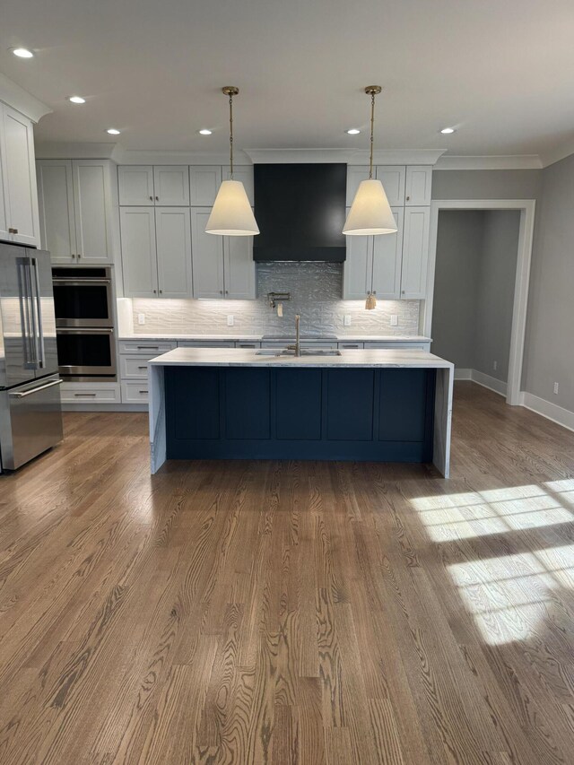 9418 Haviland Way, Ooltewah, TN 37363 - kitchen with appliances with stainless steel finishes, ventilation hood, light countertops, backsplash, and crown molding
