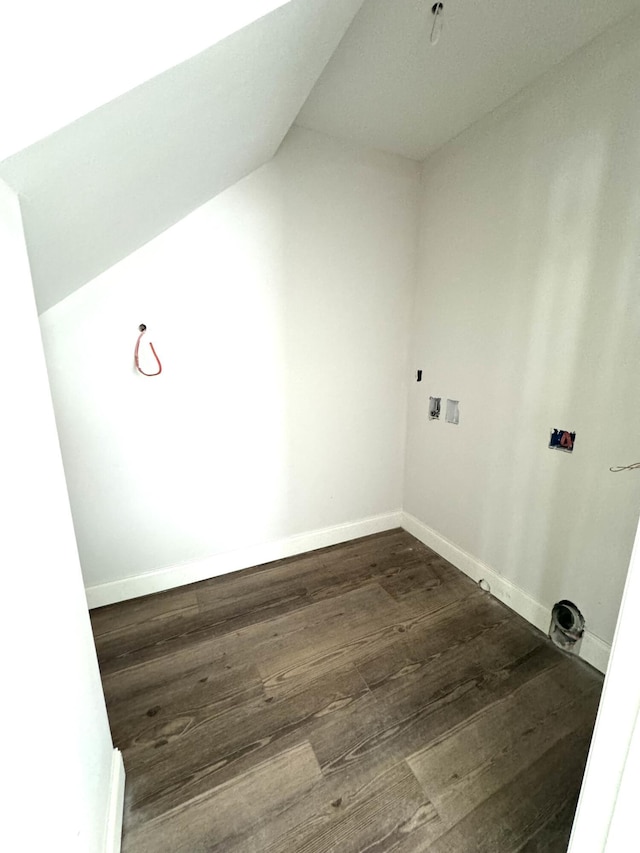 clothes washing area with hookup for a washing machine and dark hardwood / wood-style flooring