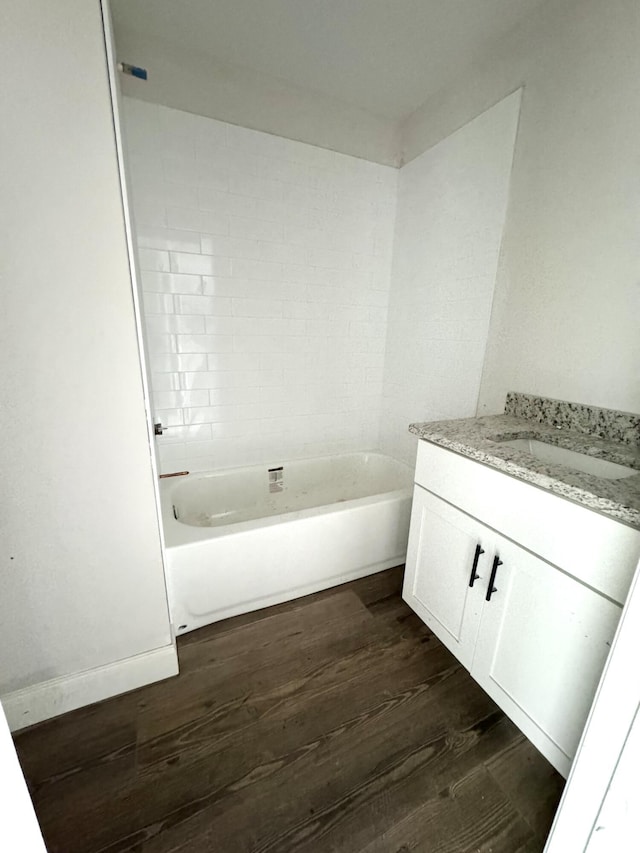 bathroom with hardwood / wood-style floors and vanity