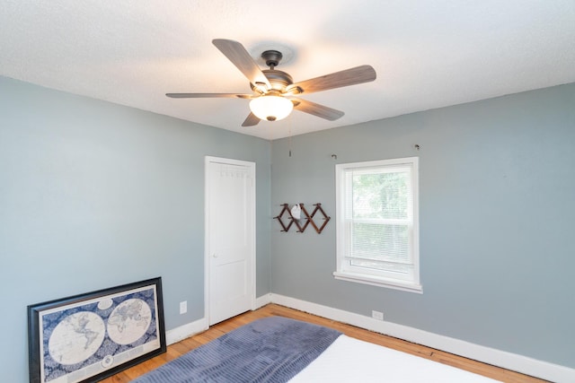 spare room with ceiling fan and hardwood / wood-style floors