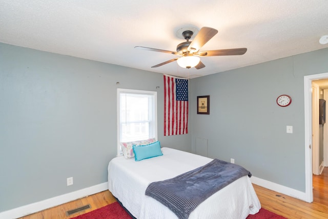 bedroom featuring ceiling fan and wood-type flooring