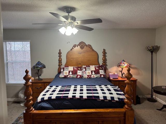 carpeted bedroom featuring ceiling fan, a textured ceiling, and multiple windows