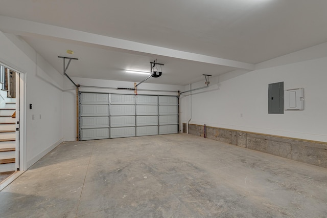 garage featuring a garage door opener and electric panel