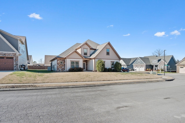 view of front of property featuring a front yard and a garage