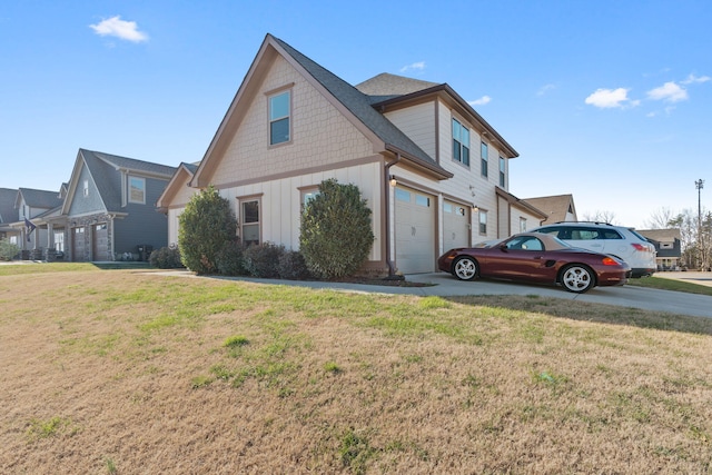 view of property exterior with a lawn and a garage