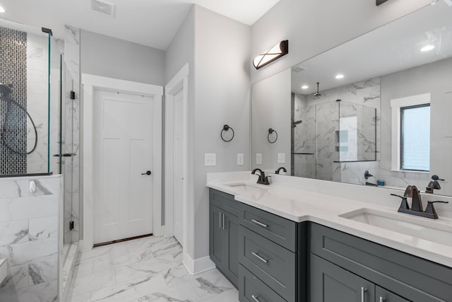 bathroom with vanity and an enclosed shower