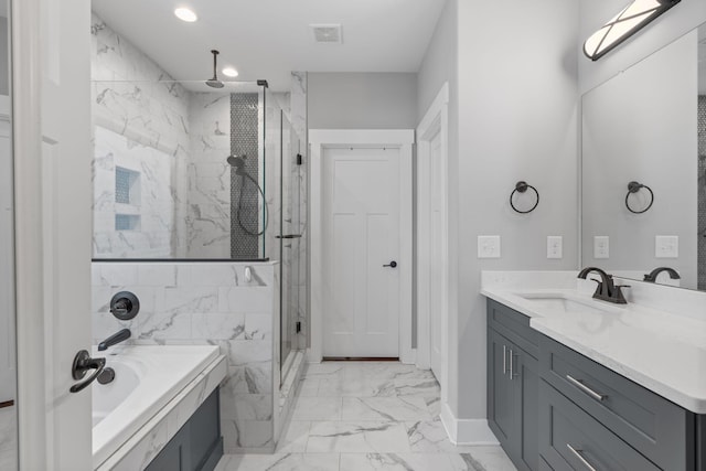 bathroom featuring vanity and shower with separate bathtub