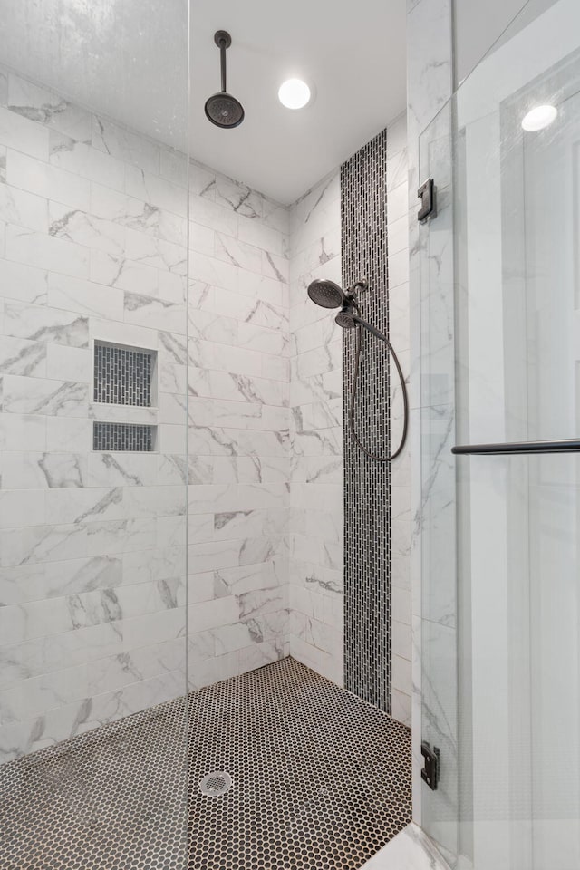 bathroom with a tile shower