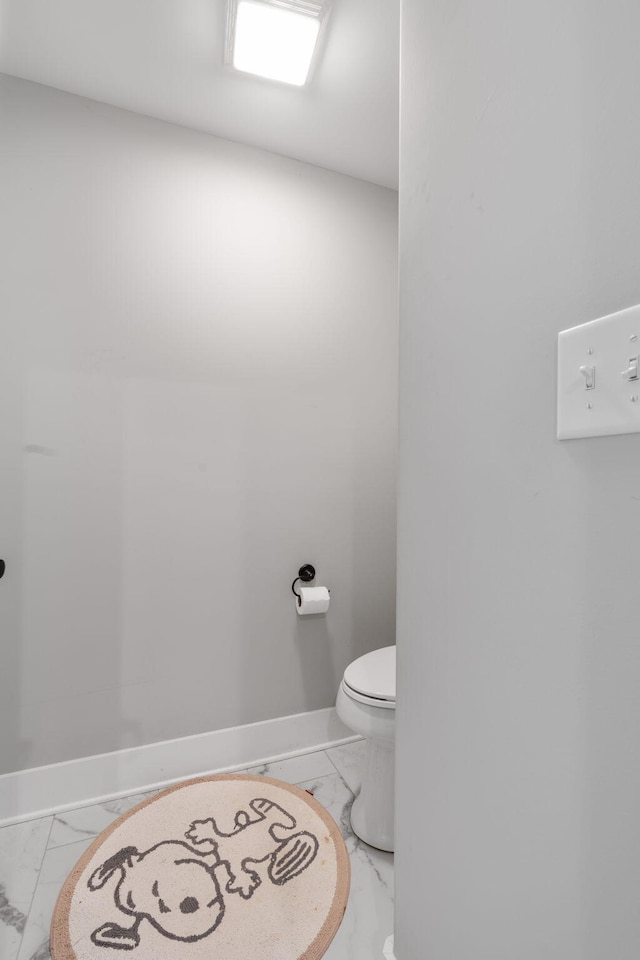 bathroom featuring toilet