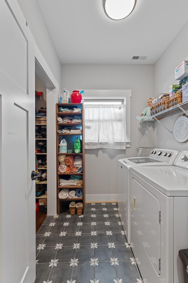 washroom with separate washer and dryer