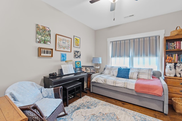 bedroom featuring ceiling fan and dark hardwood / wood-style flooring