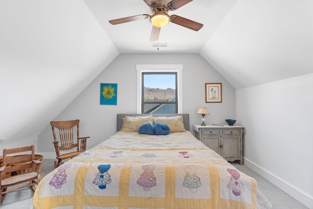 bedroom with light colored carpet, vaulted ceiling, and ceiling fan