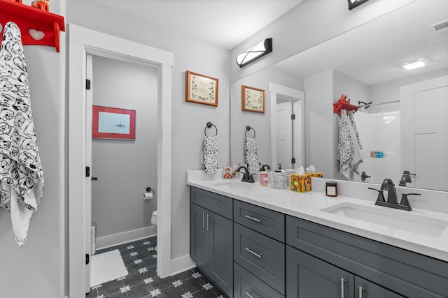 bathroom with vanity and toilet