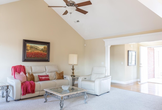 living room featuring ceiling fan, light carpet, and high vaulted ceiling