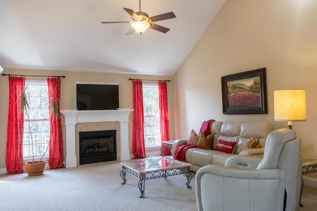 living room with lofted ceiling, ceiling fan, a fireplace, and plenty of natural light