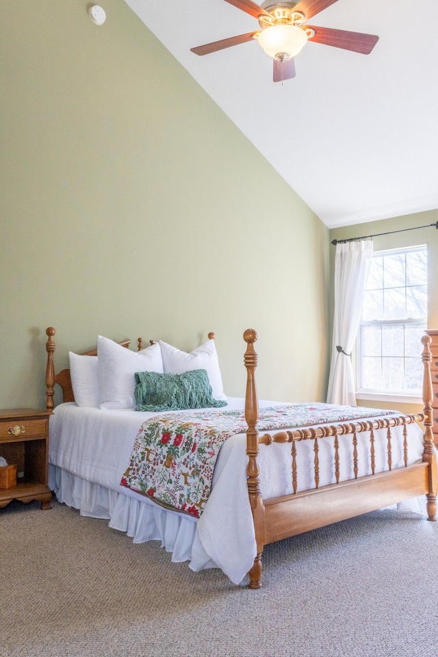 bedroom with ceiling fan, carpet, and high vaulted ceiling