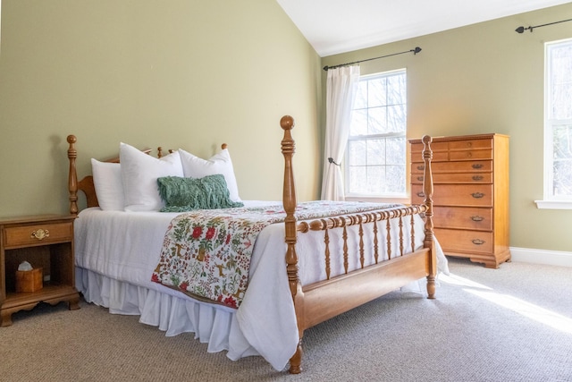 carpeted bedroom with vaulted ceiling