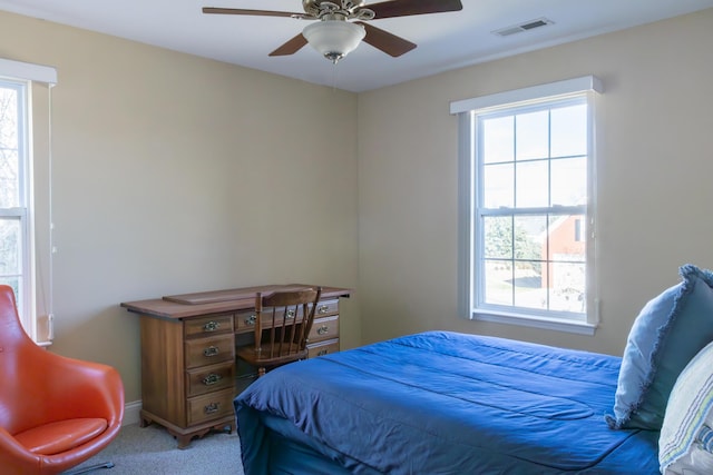 bedroom featuring ceiling fan and light colored carpet