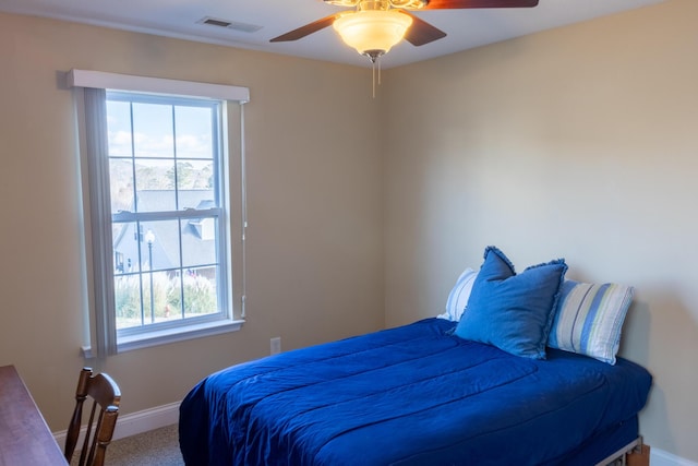 carpeted bedroom featuring ceiling fan