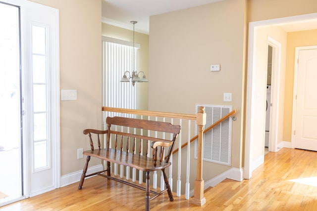 interior space featuring hardwood / wood-style floors and a chandelier