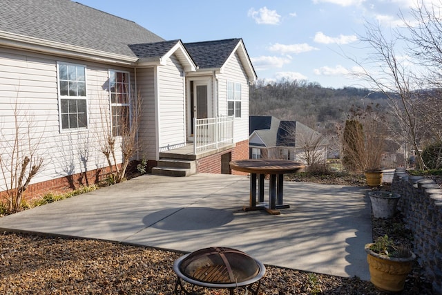 view of patio with a fire pit