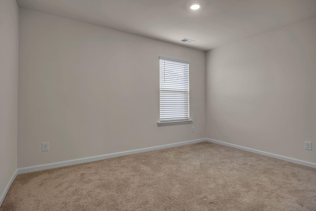 empty room with light colored carpet