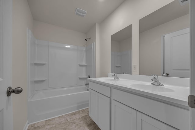 bathroom with vanity and washtub / shower combination