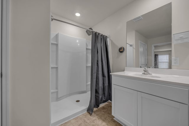 bathroom with a shower with curtain and vanity