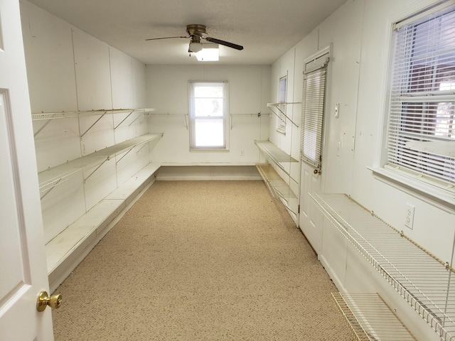 storage area featuring ceiling fan