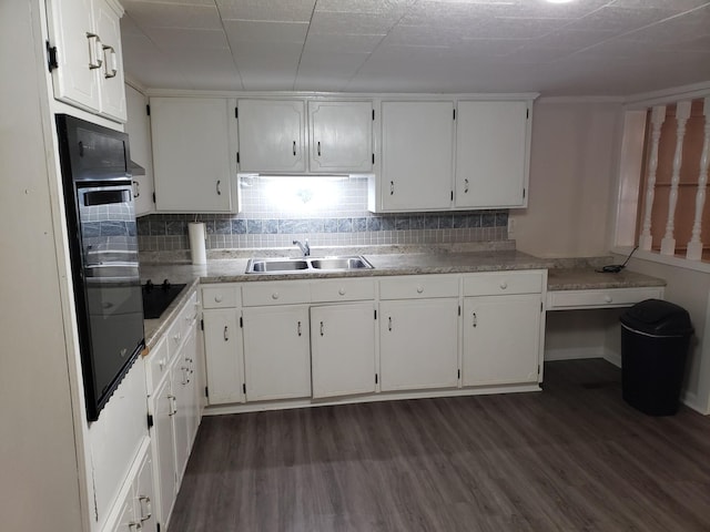 kitchen with black appliances, dark hardwood / wood-style flooring, white cabinetry, and sink