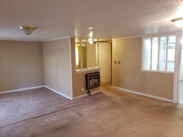 carpeted spare room featuring heating unit