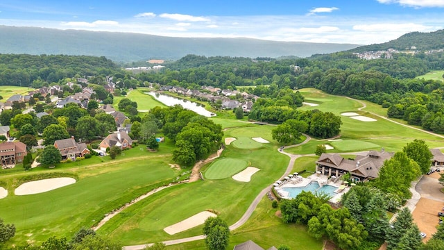 aerial view with a forest view and golf course view