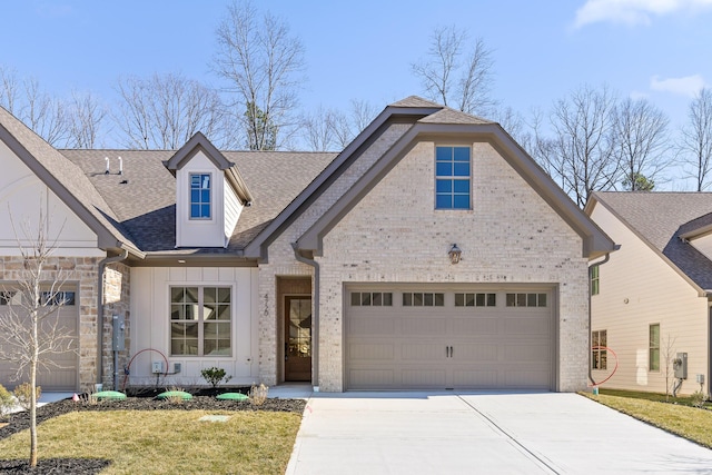 view of front of home with a garage, a shingled roof, concrete driveway, board and batten siding, and brick siding