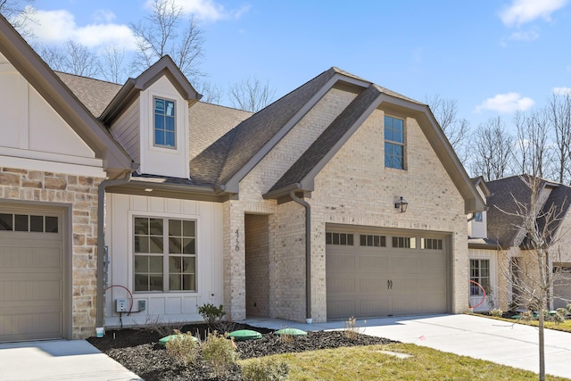 view of front of home featuring brick siding, a shingled roof, board and batten siding, a garage, and driveway