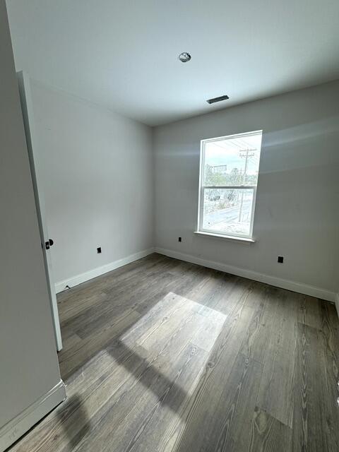 empty room featuring hardwood / wood-style floors