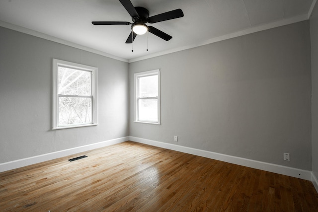 unfurnished room featuring hardwood / wood-style flooring, ceiling fan, and ornamental molding