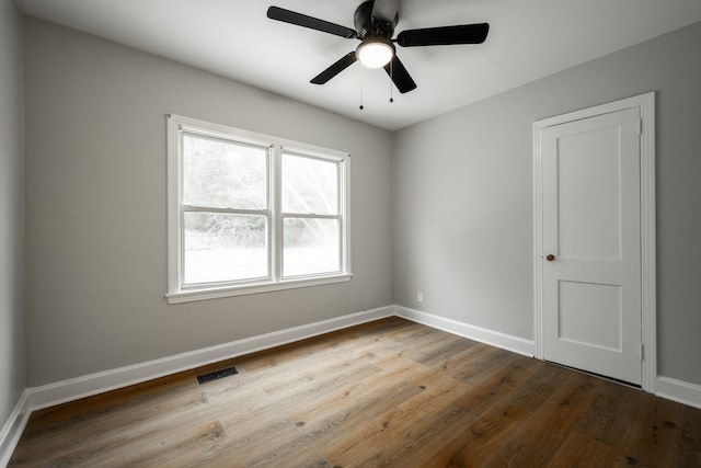 empty room featuring ceiling fan and light wood-type flooring