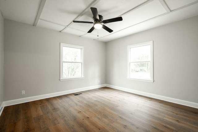 spare room featuring ceiling fan and dark hardwood / wood-style flooring