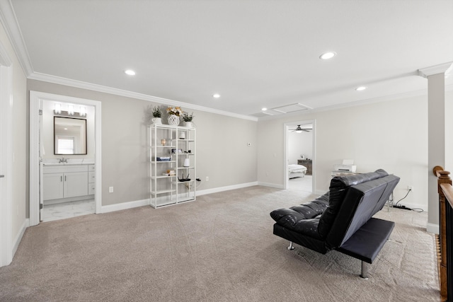 living area with light carpet, sink, and ornamental molding