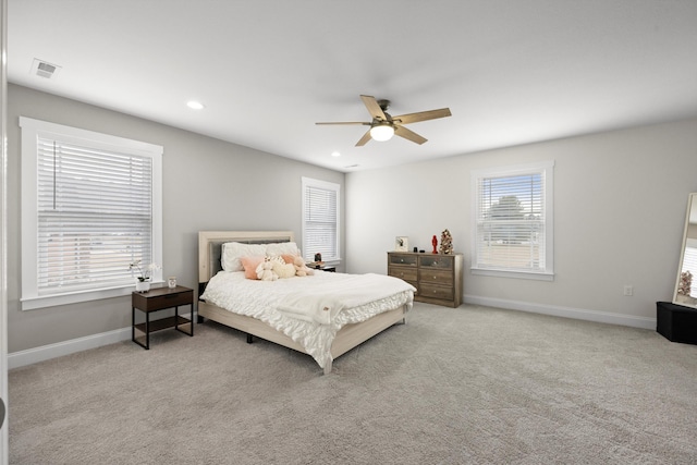 carpeted bedroom with ceiling fan